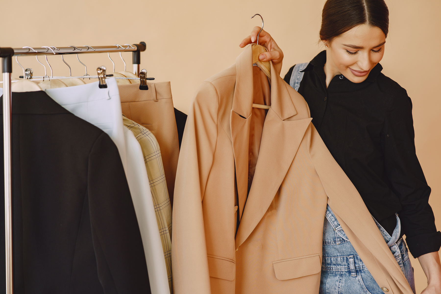 Woman Trying Blazer from Clothing Rack